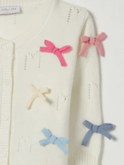 Cardigan con fiocchi all-over Monnalisa