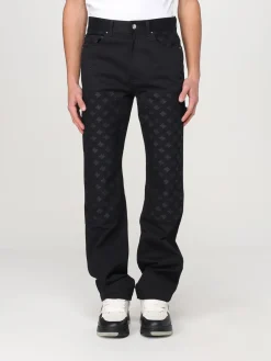 Jeans Amiri in denim con motivo monogram