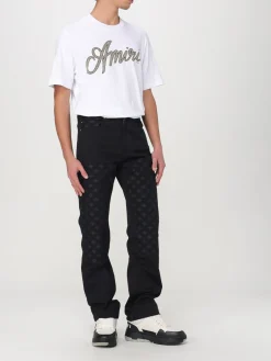 Jeans Amiri in denim con motivo monogram