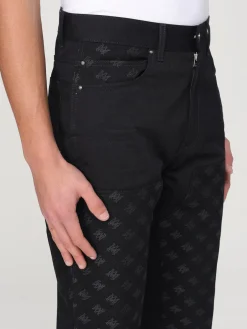 Jeans Amiri in denim con motivo monogram