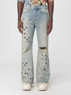Jeans con logo all-over Amiri