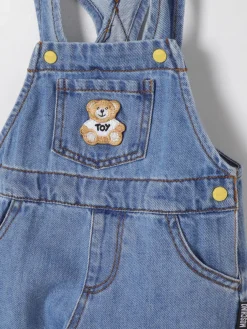 Salopette di jeans con Teddy Moschino